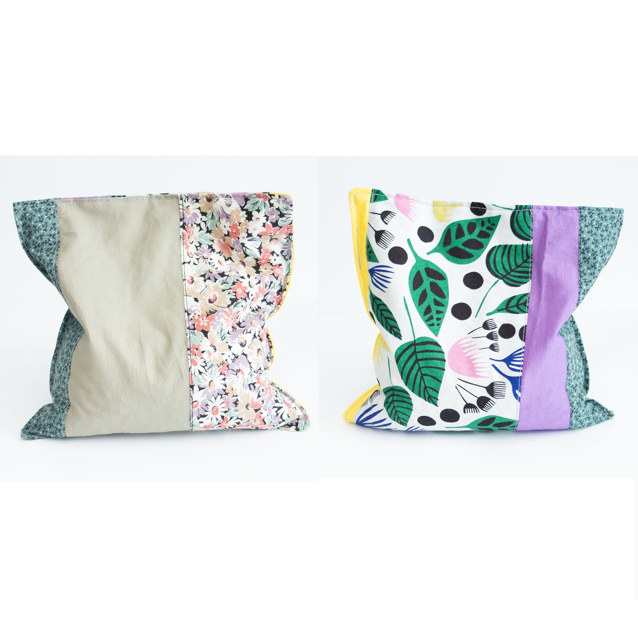 Two grain bags sit side by side showing front and back patchwork patterns. Front and back of patchwork (floral prints and solid sage green, yellow and purple) rectangle cherry pit grain bag. Sit on white background.