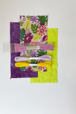 Load image into Gallery viewer, 3 fabric swatches with sashiko thread and 2 embroidery floss laying on top. Floral print colors are rdark green, purple, pink, and lilac on light pink background. Variegated purple and neon light green fabrics. Sashiko thread in lavender with embroidery threads in light purple and yellow.
