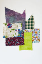 Load image into Gallery viewer, 6 small fabric swatches mainly in shades of maroon, purple, and green.
