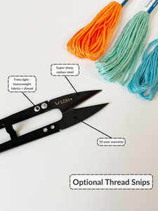 A black pair of thread snips points at 3 embroidery floss bundles in orange, sea foam green, and light blue. Text: super sharp, carbon steel. Trims light-heavyweight fabrics and thread. 10-year warranty. Optional thread snips. 