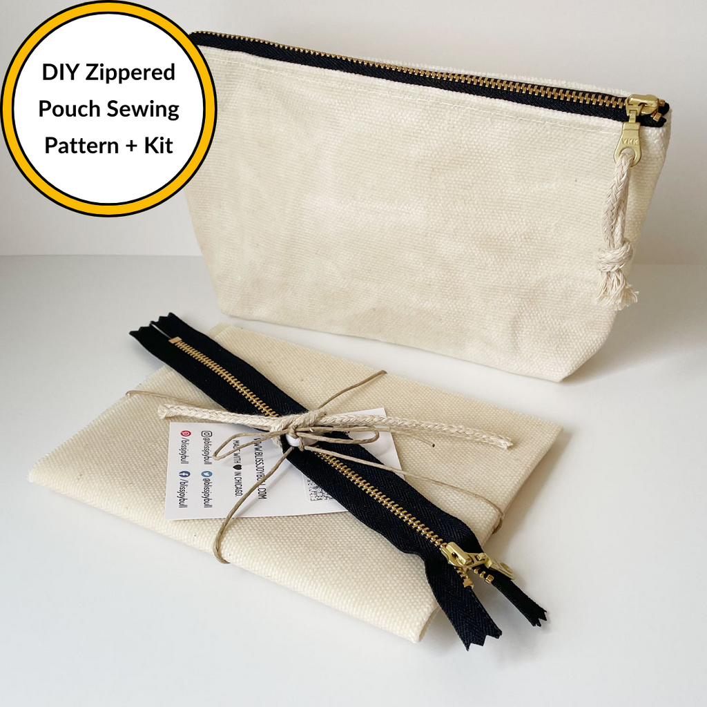 Pre-cut kit with waxed fabric, zipper, zipper pull, and QR code tied with twine lies in front of a sewn cream colored waxed zippered pouch. Top left orange outlined white with text: DIY Zippered Pouch Sewing Pattern + Kit
