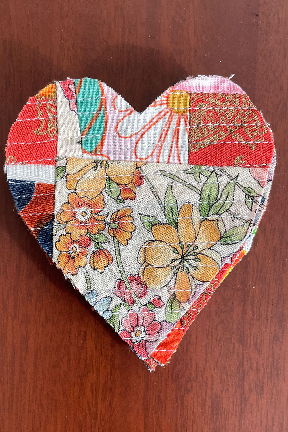 Heart-shaped crumb quilt sew-on patch. 