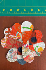 Load image into Gallery viewer, Heart shaped crumb quilt sew-on patches, spiraled out into a floral shape.
