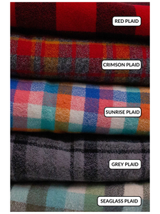 All of the plaid fabrics in a stack: Red plaid: large buffalo plaid in red and black. Crimson plaid: small plaid in shades of red, orange, and grey. Sunrise plaid: small plaid with pinks, oranges, blues, and teal greens. Seaglass plaid: larger plaid with greens, light blue, and grey. Grey plaid: small plaid with greys and black. 