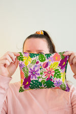 Load image into Gallery viewer, Woman holds a cherry pit grain bag covering most of her face.
